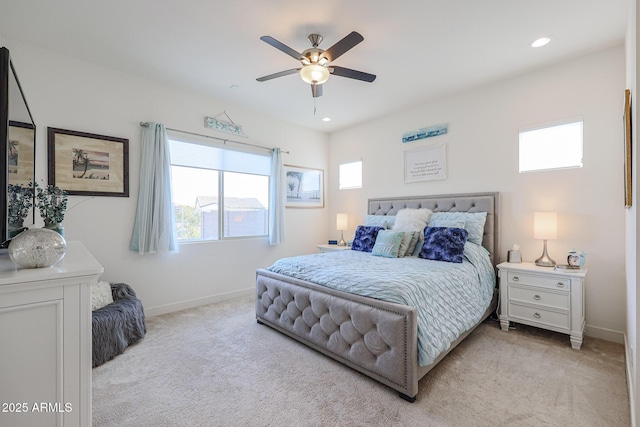 bedroom with light colored carpet and ceiling fan