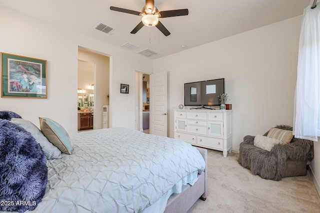 carpeted bedroom featuring connected bathroom and ceiling fan