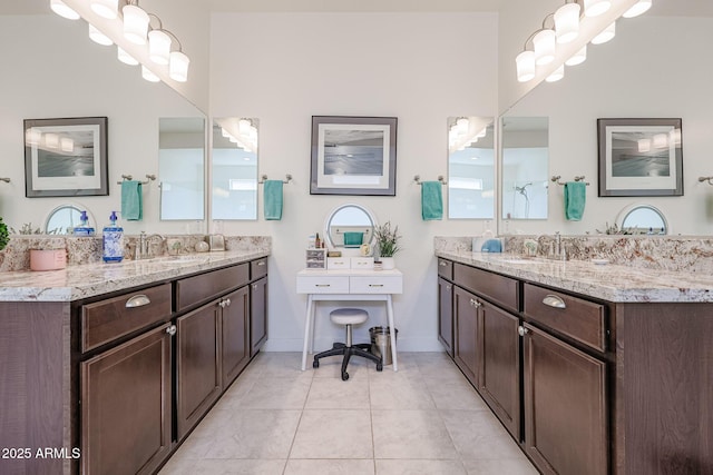 bathroom with vanity and tile patterned flooring