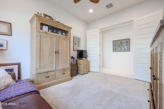 carpeted bedroom with ceiling fan