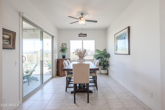 tiled dining area with ceiling fan