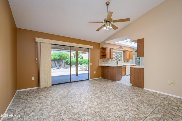 13721 W Franciscan Dr, Sun City West, AZ 85375 - kitchen with brown cabinets, dishwasher, ceiling fan, light countertops, and open shelves