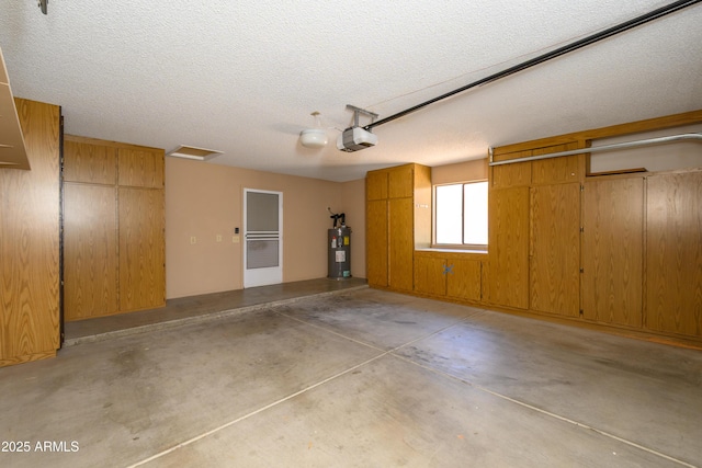 13721 W Franciscan Dr, Sun City West, AZ 85375 - garage featuring water heater and a garage door opener