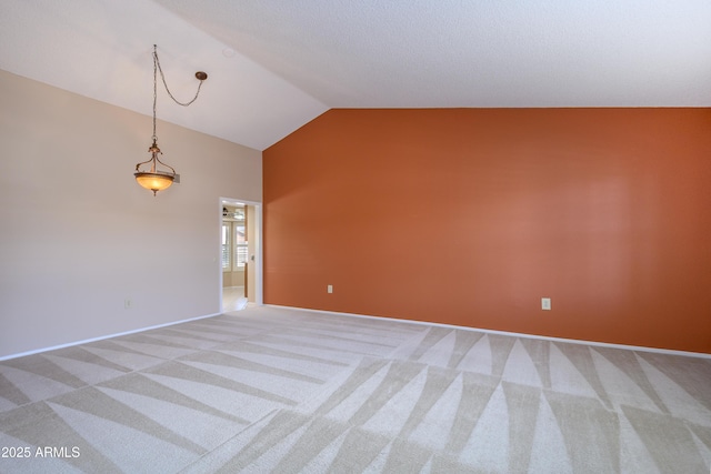13721 W Franciscan Dr, Sun City West, AZ 85375 - spare room featuring light colored carpet, high vaulted ceiling, and baseboards