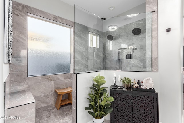 bathroom with tiled shower