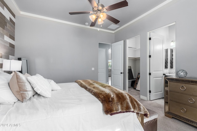 carpeted bedroom featuring a spacious closet, connected bathroom, a closet, and ceiling fan