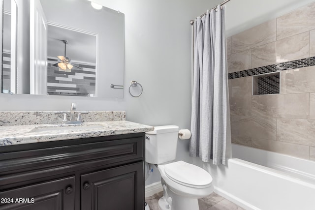 full bathroom with ceiling fan, vanity, shower / bath combo with shower curtain, and toilet