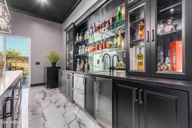 bar featuring sink and ornamental molding