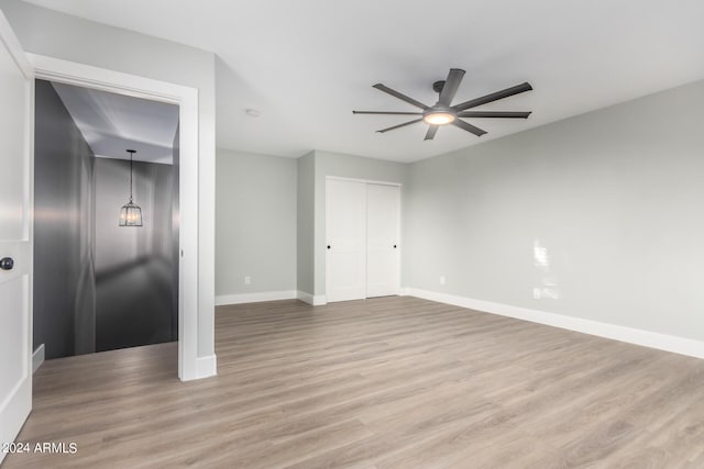 unfurnished room with ceiling fan and light hardwood / wood-style flooring