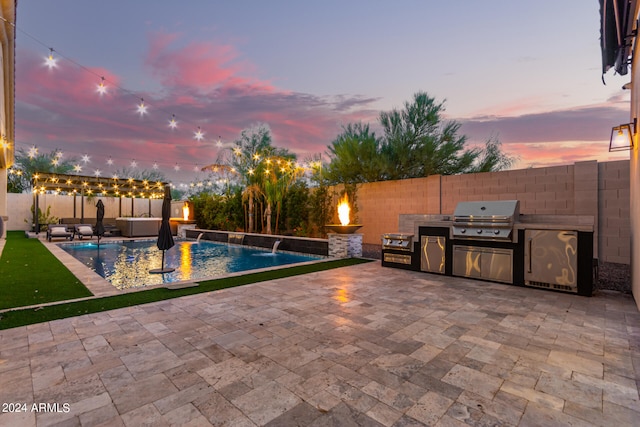 pool at dusk with pool water feature, a patio, area for grilling, and a grill