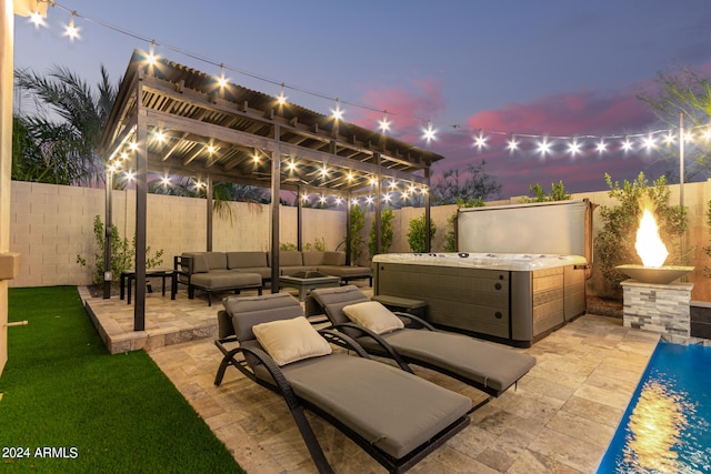 patio terrace at dusk featuring outdoor lounge area