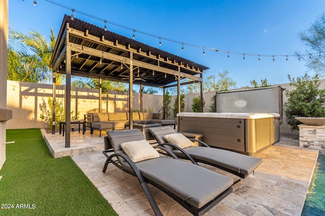 view of patio / terrace with a hot tub and outdoor lounge area