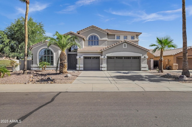 11257 E Reginald Ave, Mesa, AZ 85212 - mediterranean / spanish-style home with stucco siding, a tile roof, driveway, and an attached garage