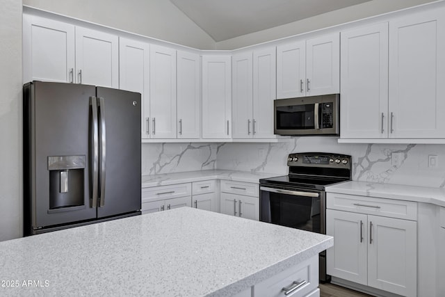 11257 E Reginald Ave, Mesa, AZ 85212 - kitchen featuring stainless steel appliances, lofted ceiling, tasteful backsplash, white cabinets, and light stone countertops