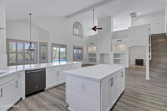 11257 E Reginald Ave, Mesa, AZ 85212 - kitchen featuring dishwasher, high vaulted ceiling, a chandelier, open floor plan, and white cabinetry