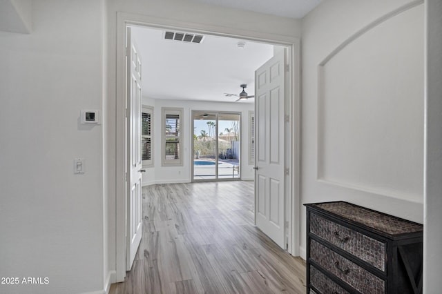 11257 E Reginald Ave, Mesa, AZ 85212 - hallway with light wood-style floors and baseboards