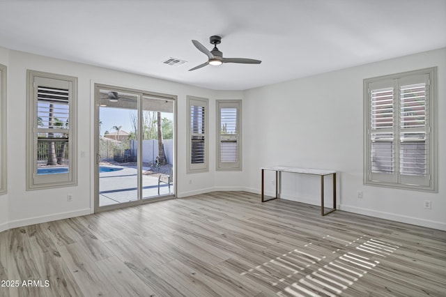 11257 E Reginald Ave, Mesa, AZ 85212 - unfurnished room featuring ceiling fan and wood finished floors