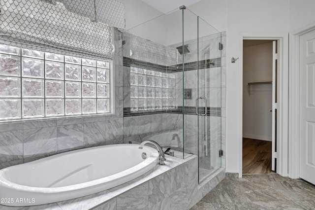 11257 E Reginald Ave, Mesa, AZ 85212 - bathroom featuring a garden tub, a shower stall, marble finish flooring, and a walk in closet