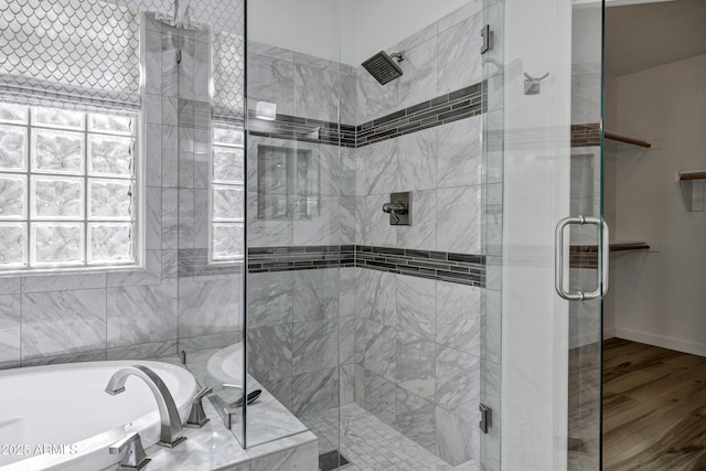 11257 E Reginald Ave, Mesa, AZ 85212 - bathroom with a stall shower, a garden tub, and wood finished floors