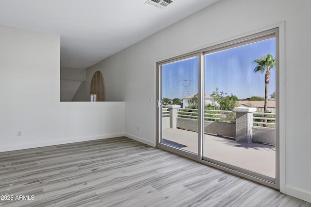 11257 E Reginald Ave, Mesa, AZ 85212 - spare room featuring wood finished floors and healthy amount of natural light
