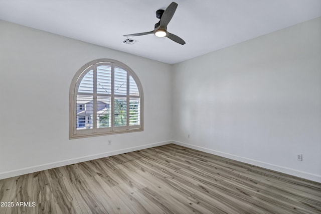 11257 E Reginald Ave, Mesa, AZ 85212 - unfurnished room with wood finished floors and a ceiling fan
