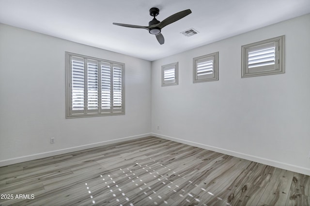 11257 E Reginald Ave, Mesa, AZ 85212 - empty room with a ceiling fan and wood finished floors