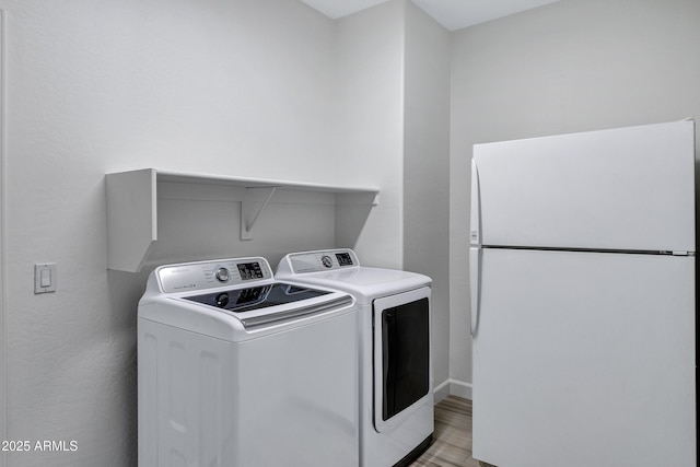 11257 E Reginald Ave, Mesa, AZ 85212 - laundry room featuring washer and dryer and light wood-style flooring