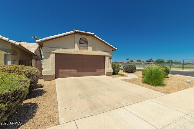 1950 E Kings Ave, Phoenix, AZ 85022 - single story home featuring stucco siding, a tiled roof, concrete driveway, and a garage