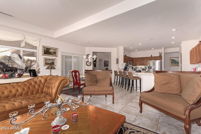 living room featuring an inviting chandelier