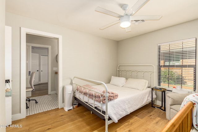 bedroom featuring ceiling fan and light hardwood / wood-style flooring