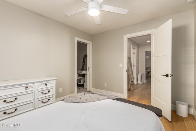 bedroom featuring light hardwood / wood-style floors and ceiling fan