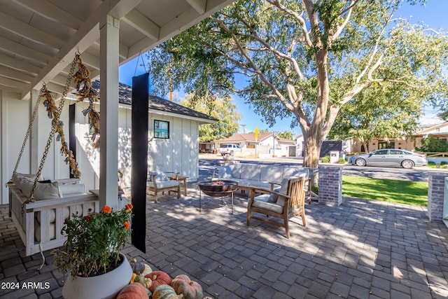 view of patio / terrace featuring a fire pit