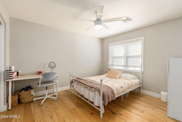 bedroom featuring ceiling fan and light hardwood / wood-style flooring