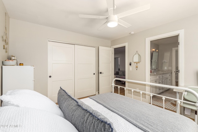 bedroom with a closet, ceiling fan, and ensuite bath