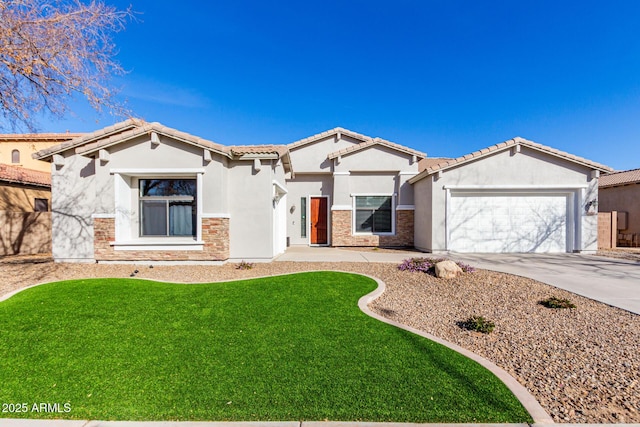 view of front of house featuring a garage and a front yard