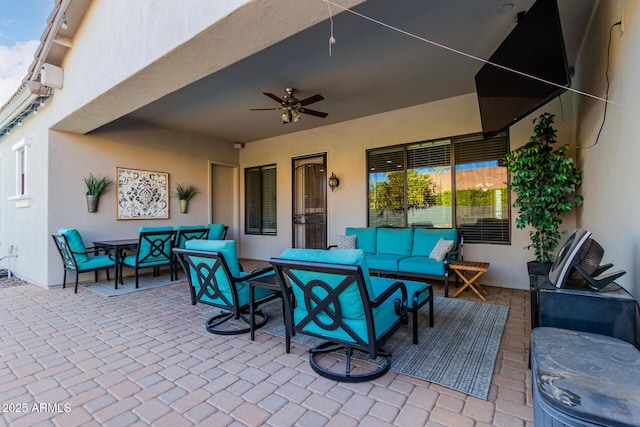 view of patio featuring outdoor lounge area and ceiling fan