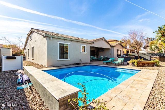 view of swimming pool featuring a jacuzzi and a patio area