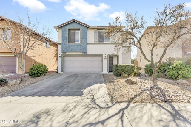 view of front facade featuring a garage, concrete driveway, a tile roof, and stucco siding