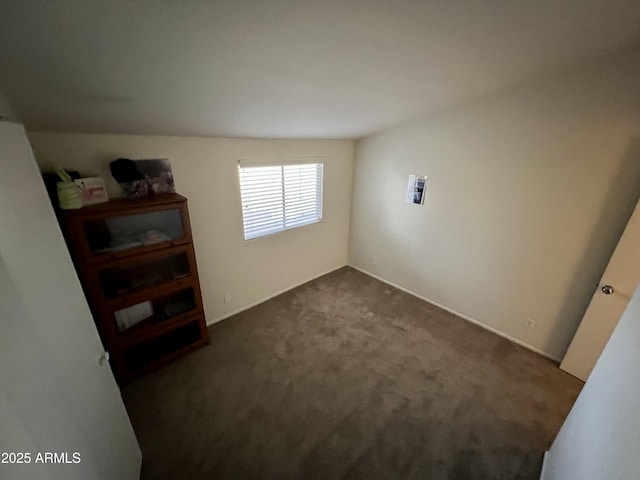 bedroom featuring dark carpet