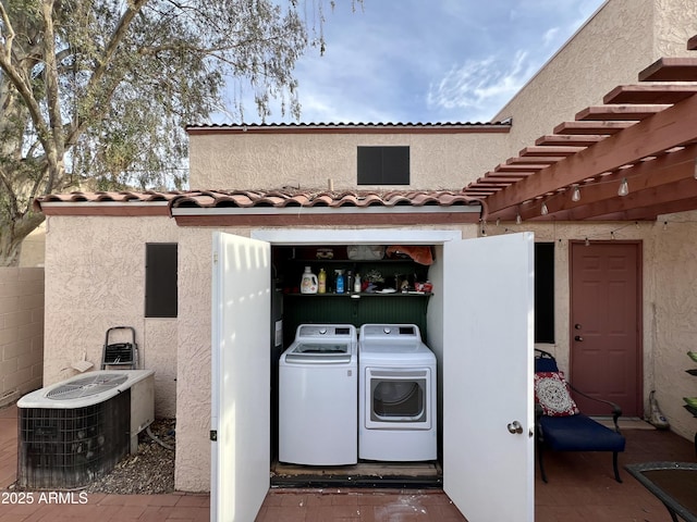 washroom with separate washer and dryer