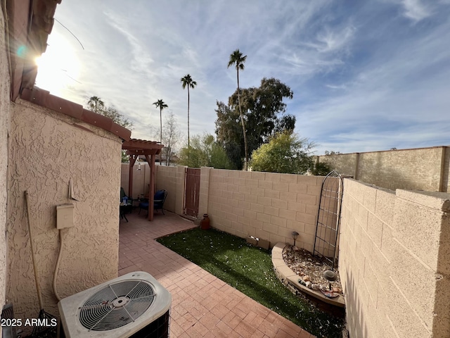 view of patio featuring a pergola and central AC unit