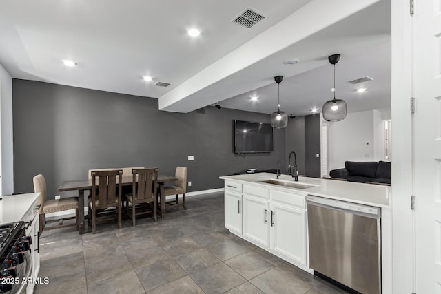 kitchen featuring pendant lighting, sink, stainless steel appliances, and white cabinets