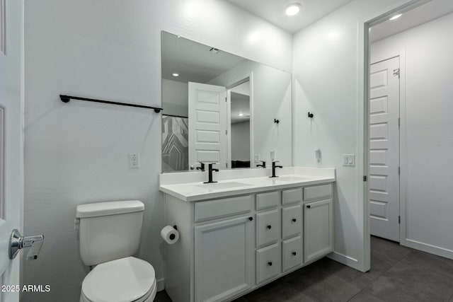 bathroom with vanity and toilet