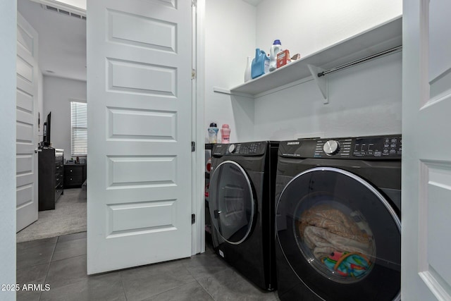 washroom featuring tile patterned flooring and independent washer and dryer