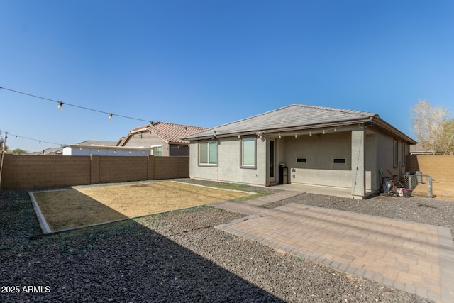 back of house featuring a patio area