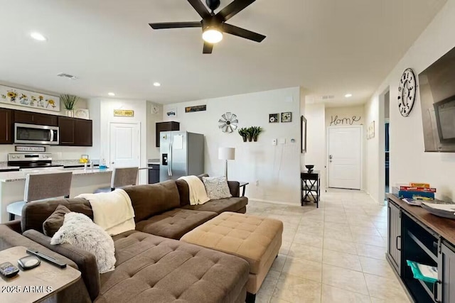 tiled living room featuring ceiling fan