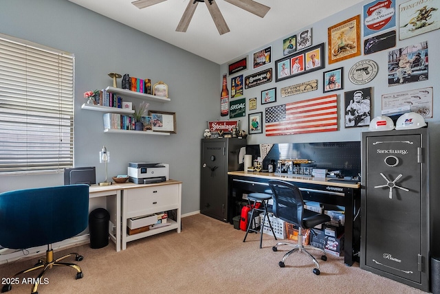 home office featuring light colored carpet and ceiling fan