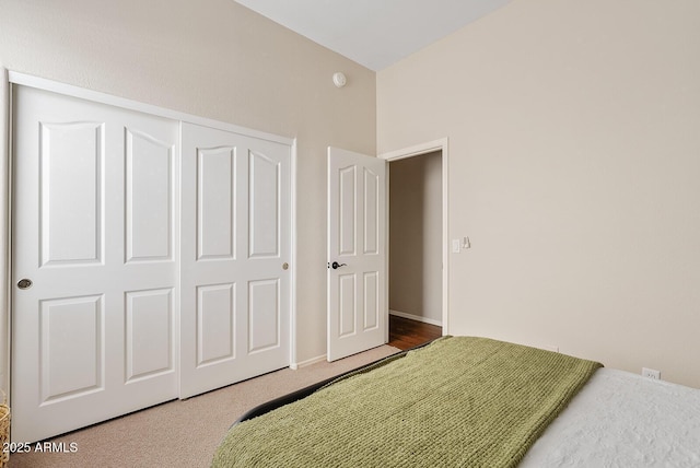 bedroom featuring a closet and carpet flooring