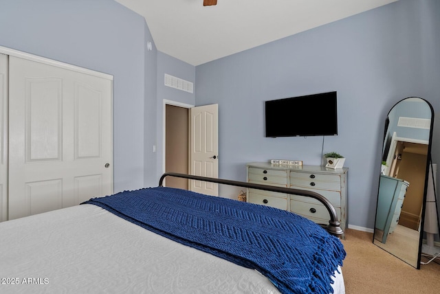 bedroom featuring light colored carpet and ceiling fan