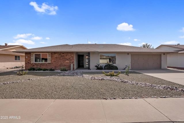 ranch-style home featuring driveway, a shingled roof, a garage, and brick siding